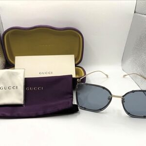 Gucci Women's Gold Frame Sunglasses with Gray-Blue Lenses
